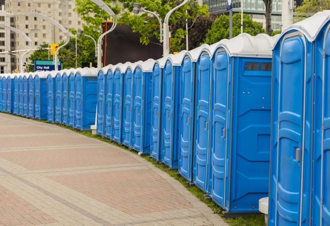 a line of portable restrooms at a sporting event, providing athletes and spectators with clean and accessible facilities in Agawam, MA